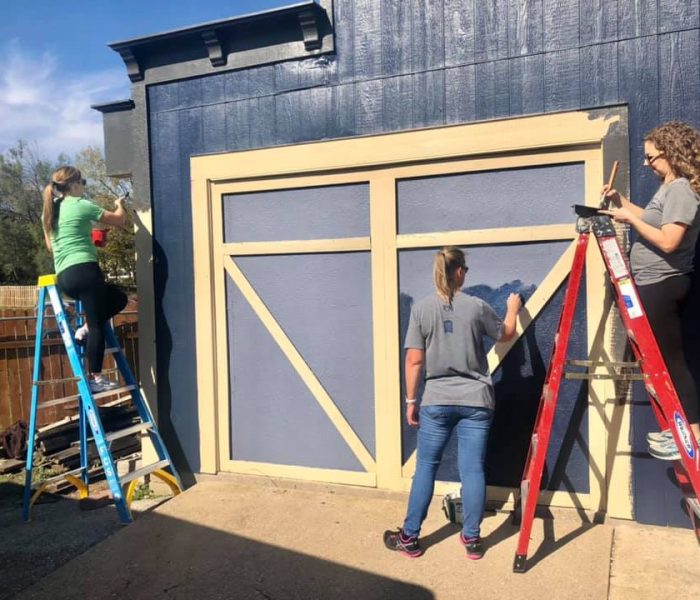 Painting around the campus at the Freedom for Youth Volunteer Day for the Foster Group Team