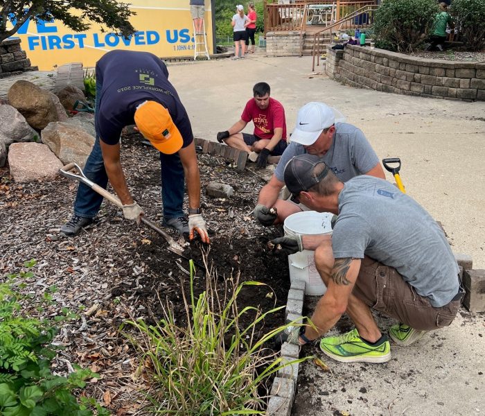 Landscaping at the Freedom for Youth Volunteer Day for the Foster Group Team